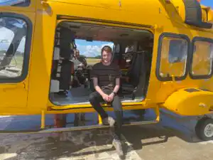 Wil Green sitting in our AW 169 helicopter during his visit in July 2023