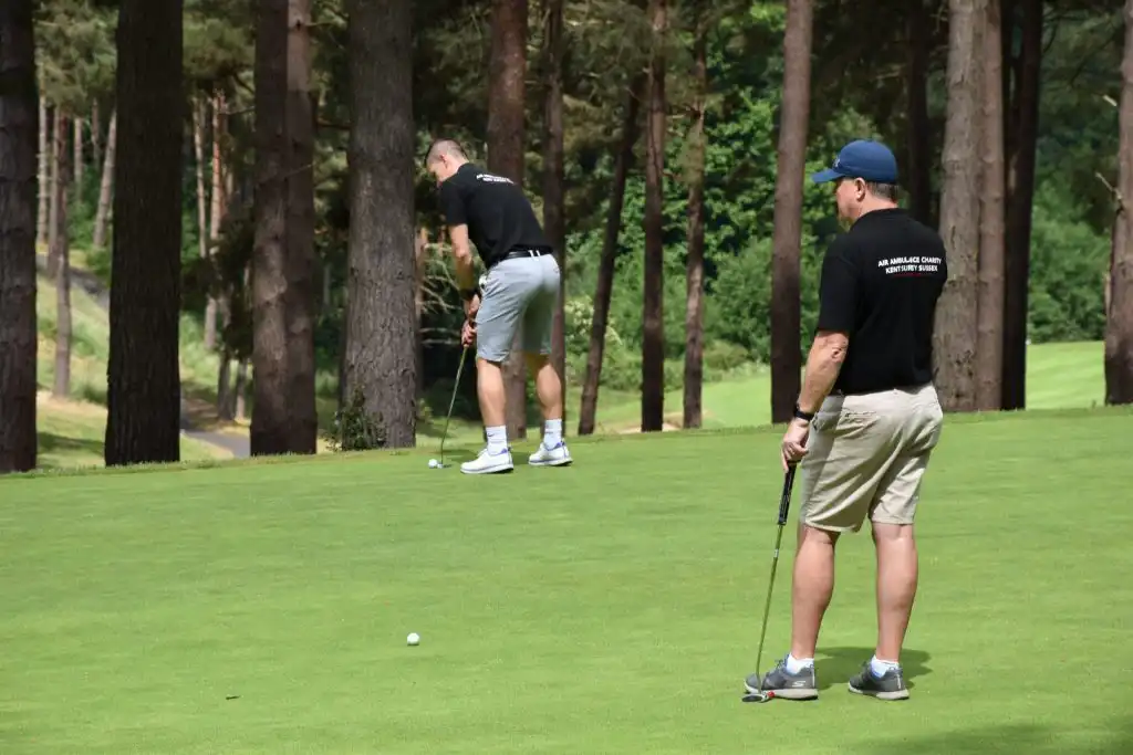 KSS crew member on the green