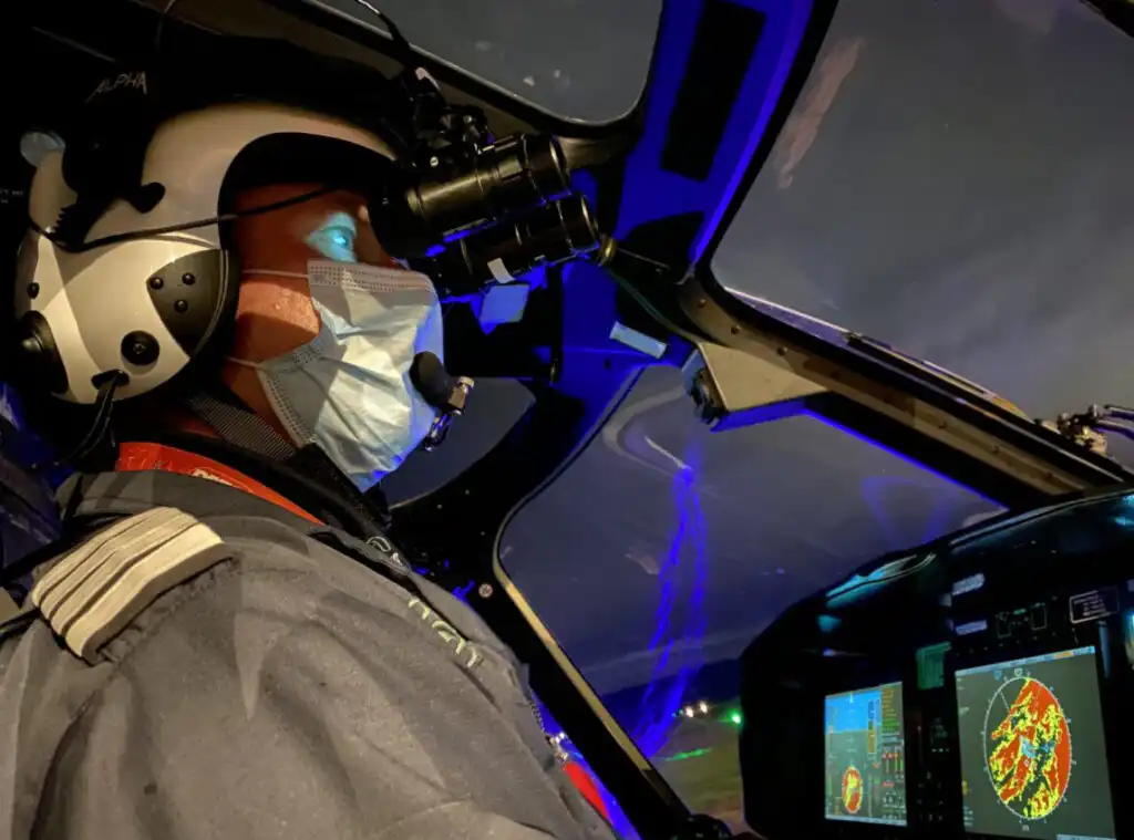 A pilot wearing night vision goggles
