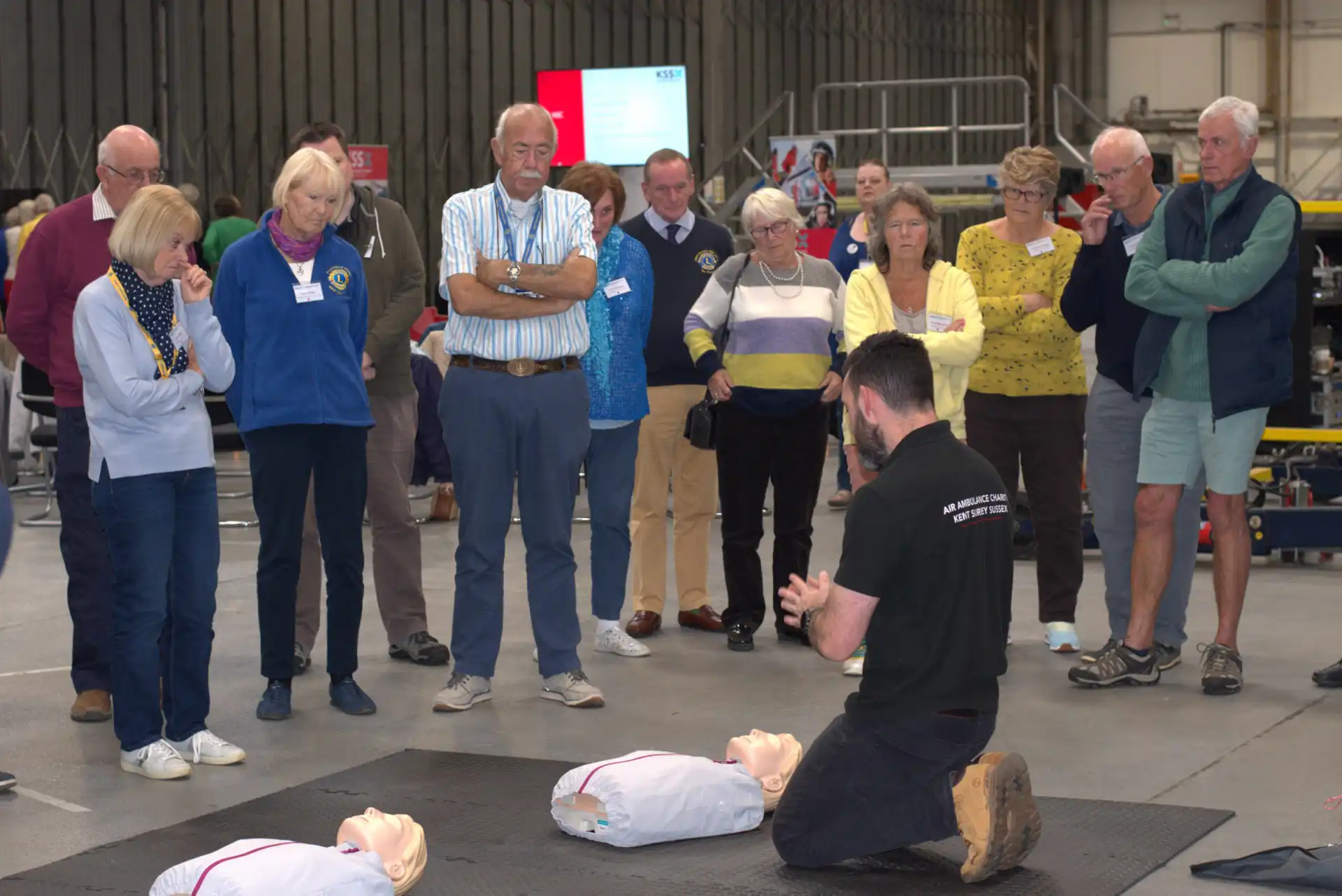 People watching a demonstration of CPR