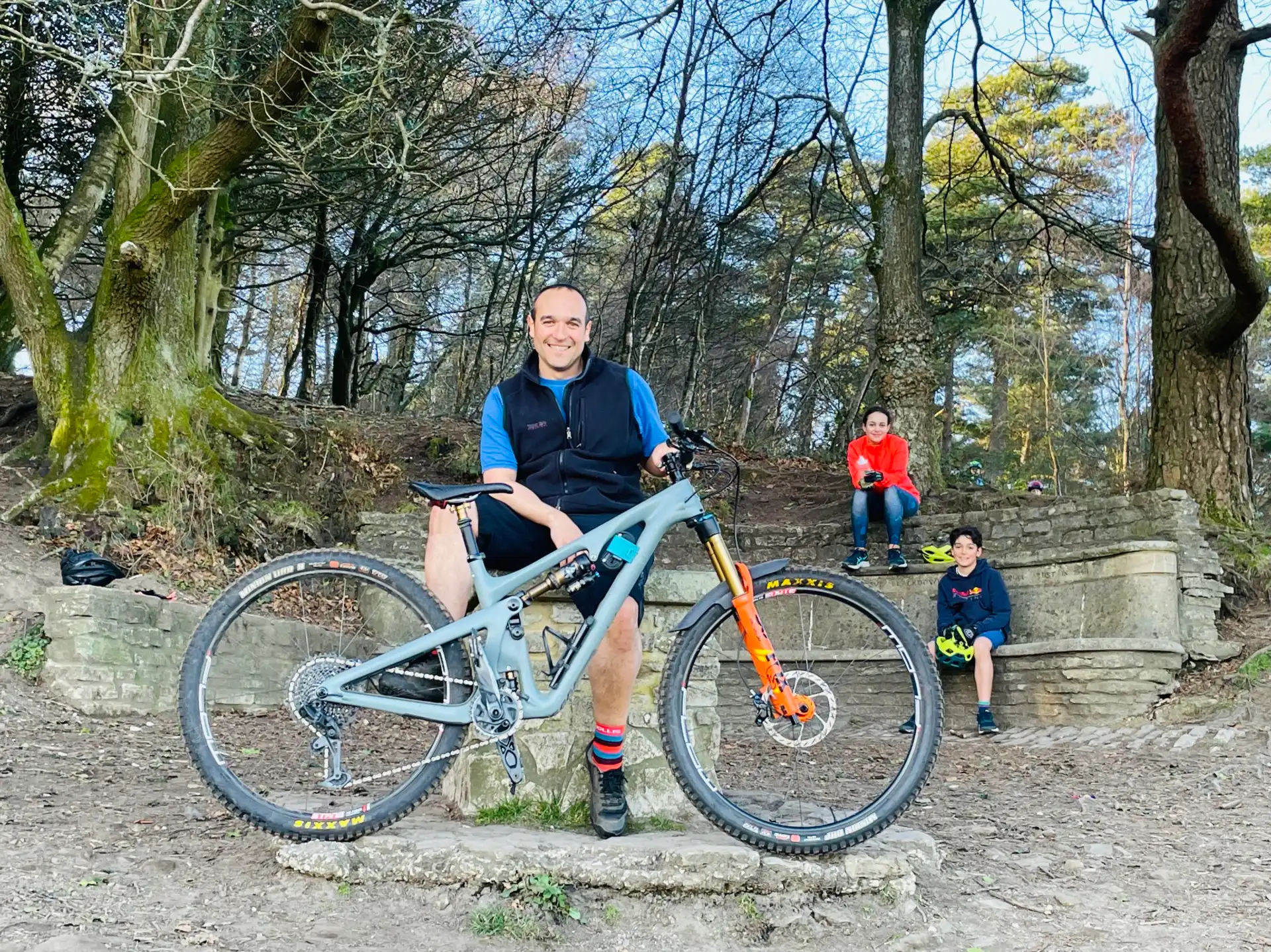 Man standing with bicycle