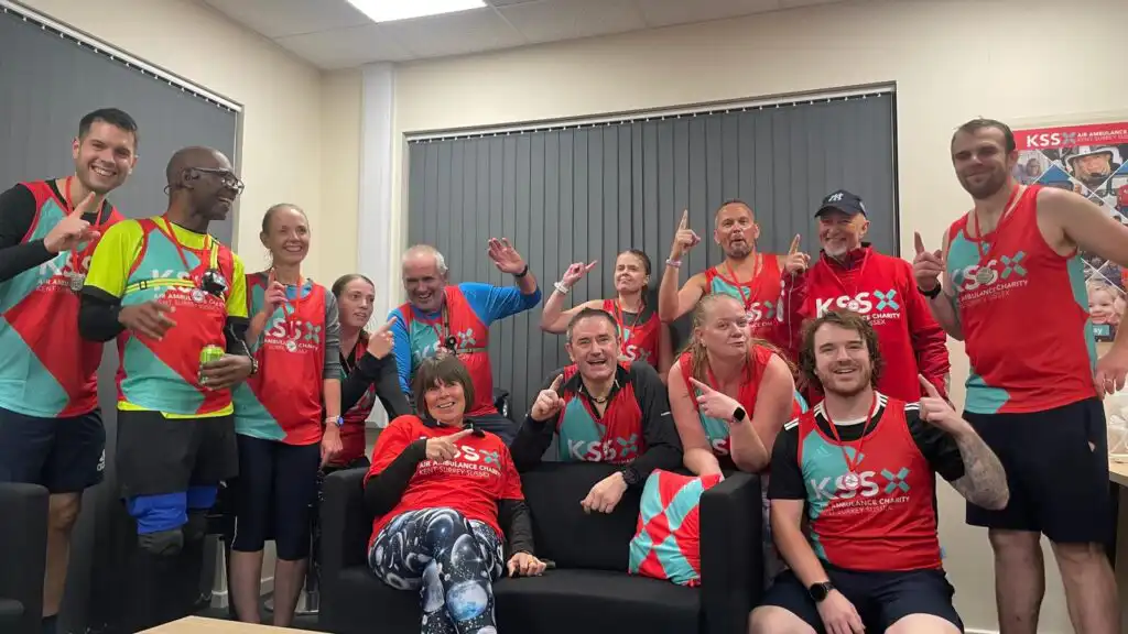 Steve, his fellow runners and their supporters celebrating after completing their epic run